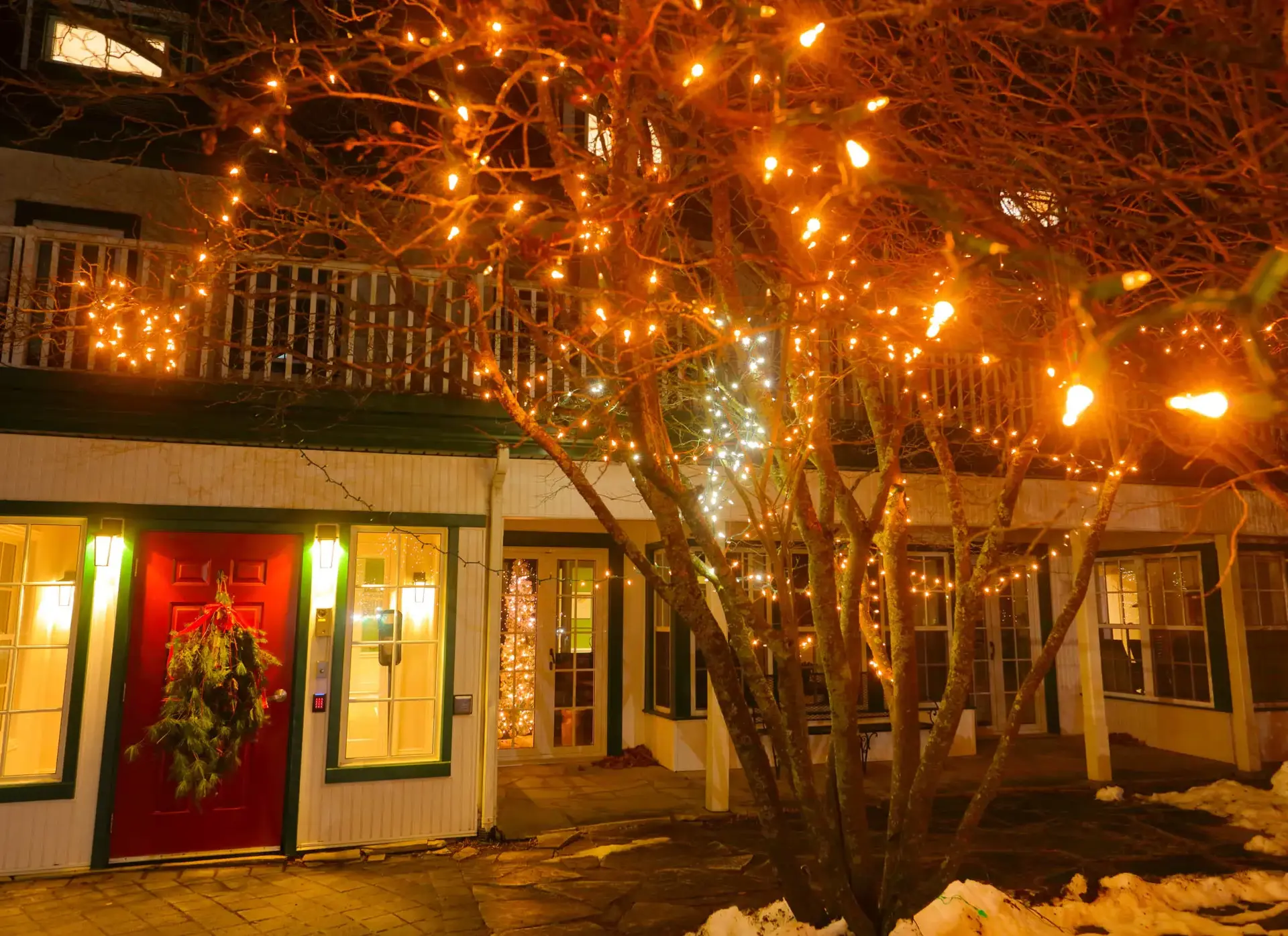 Exterior shot of Lakefield building, lit up with fairy lights