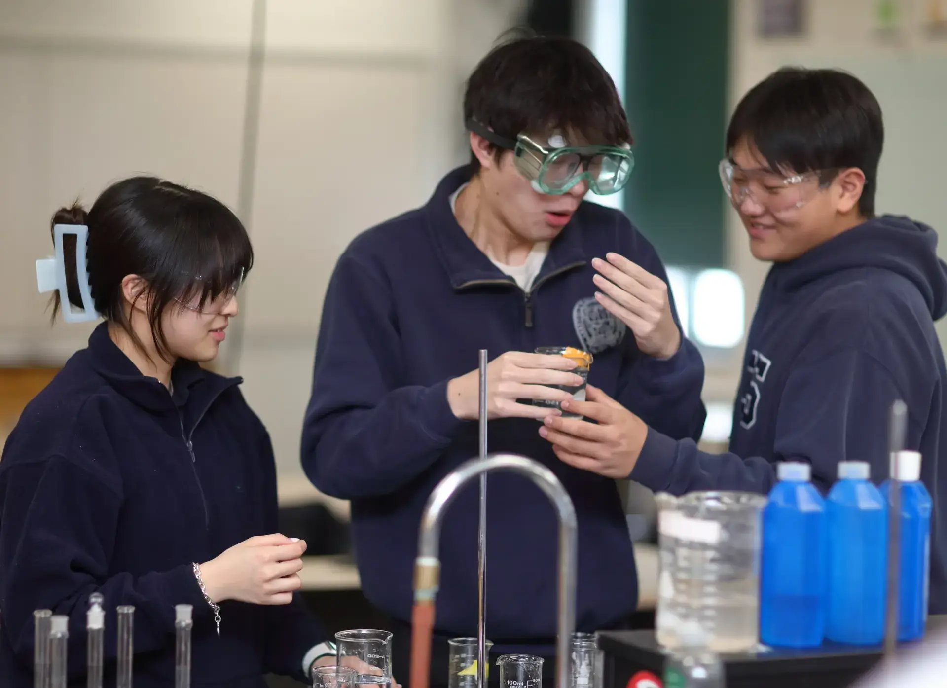 Students working together in the science lab watching reactions