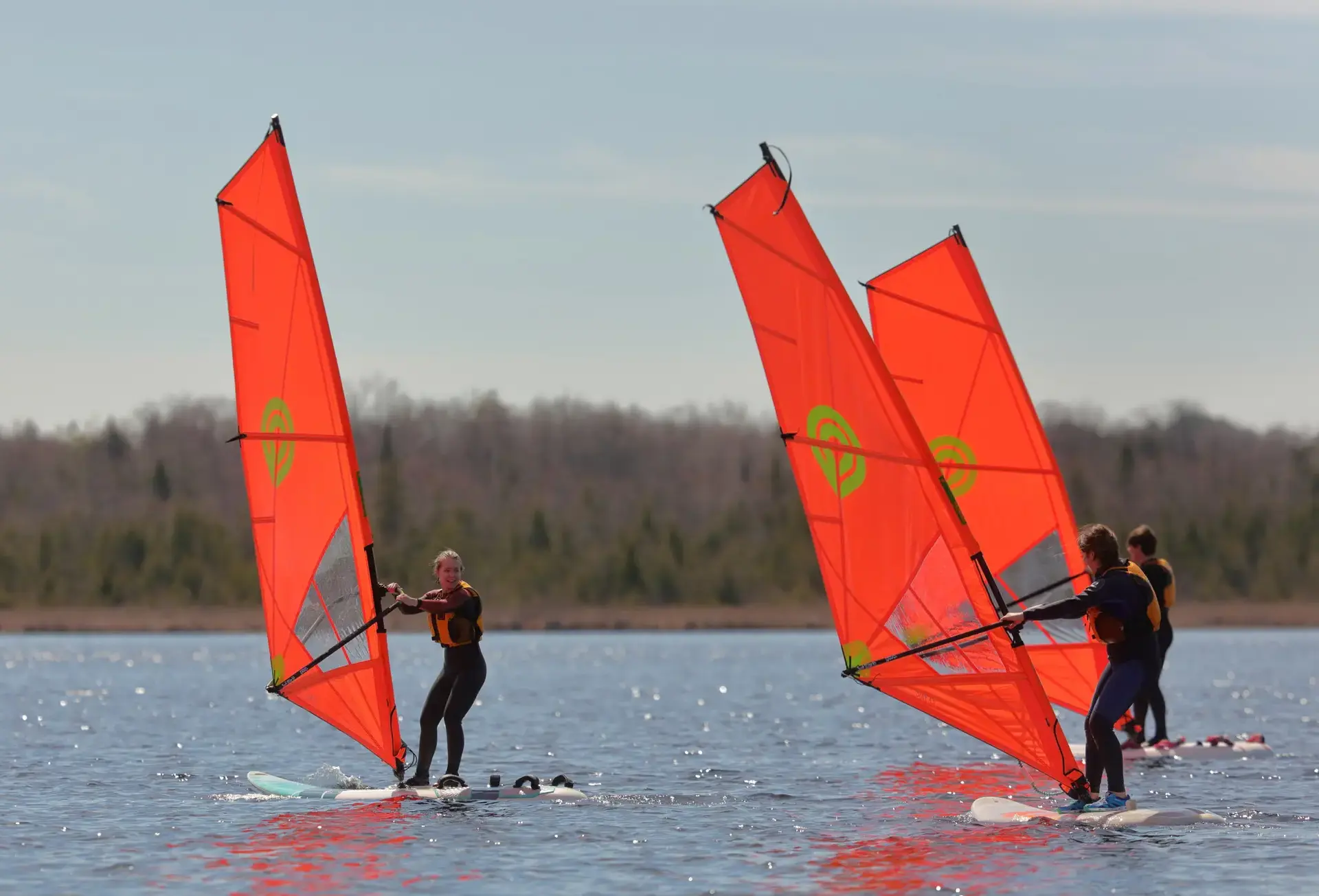 Students sailing on lake