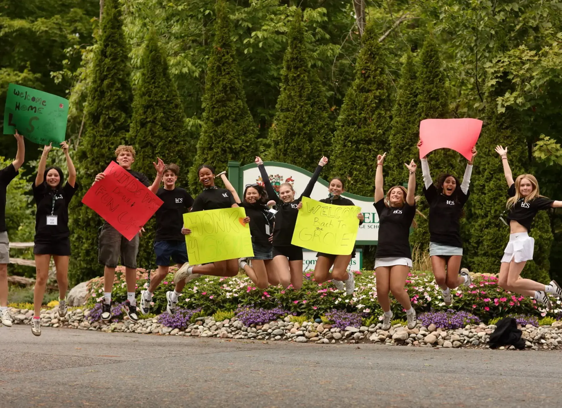 Lakefield College School students jumping to welcome new students to the campus