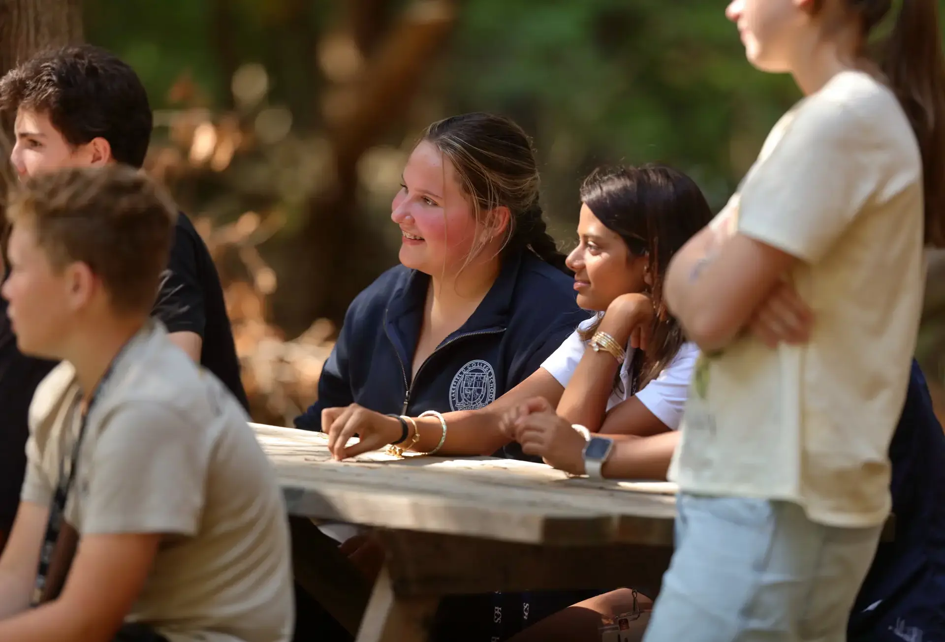 Students listening during outdoor lesson