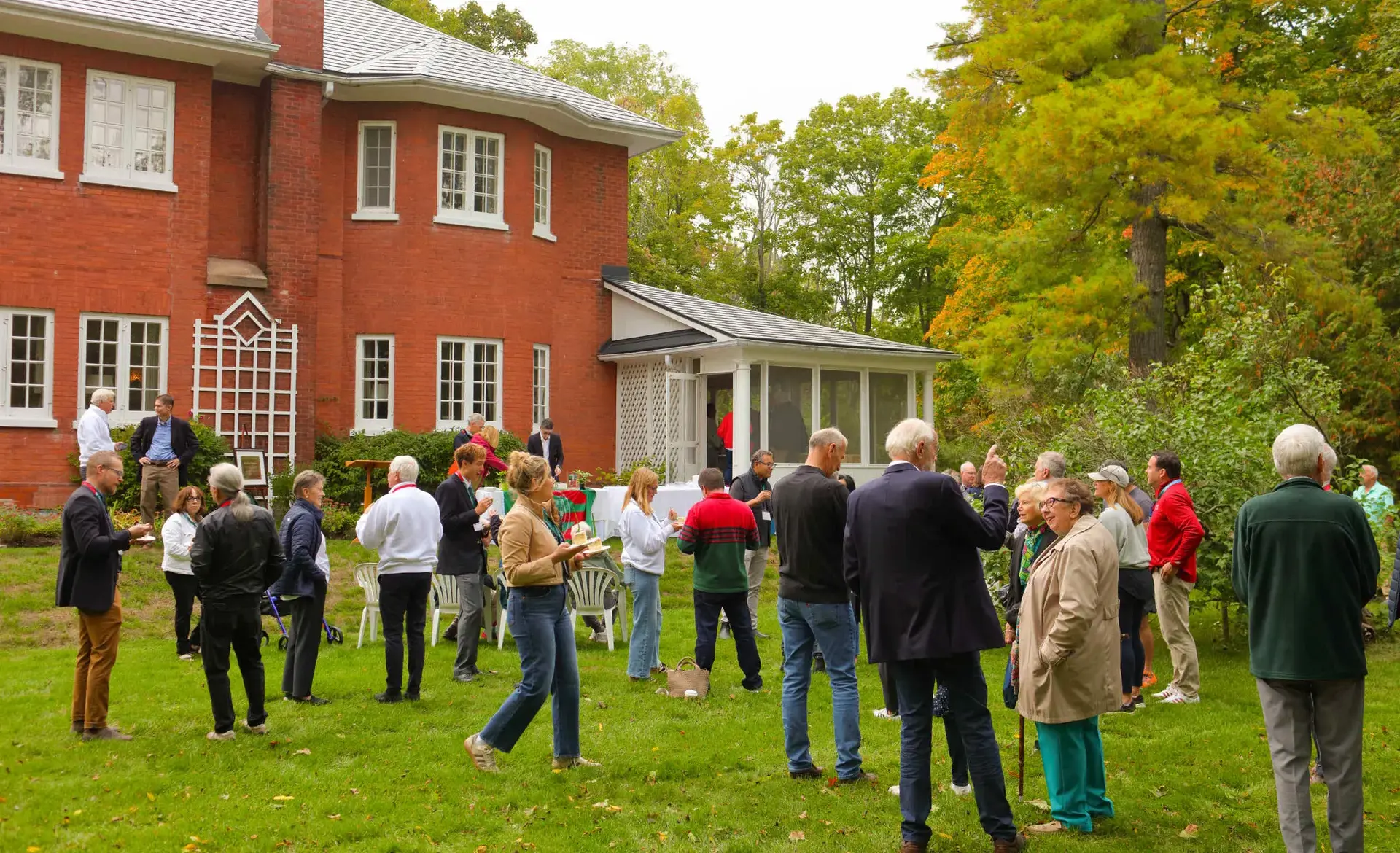 Staff, boar dmembers, trustees and locals networking outside