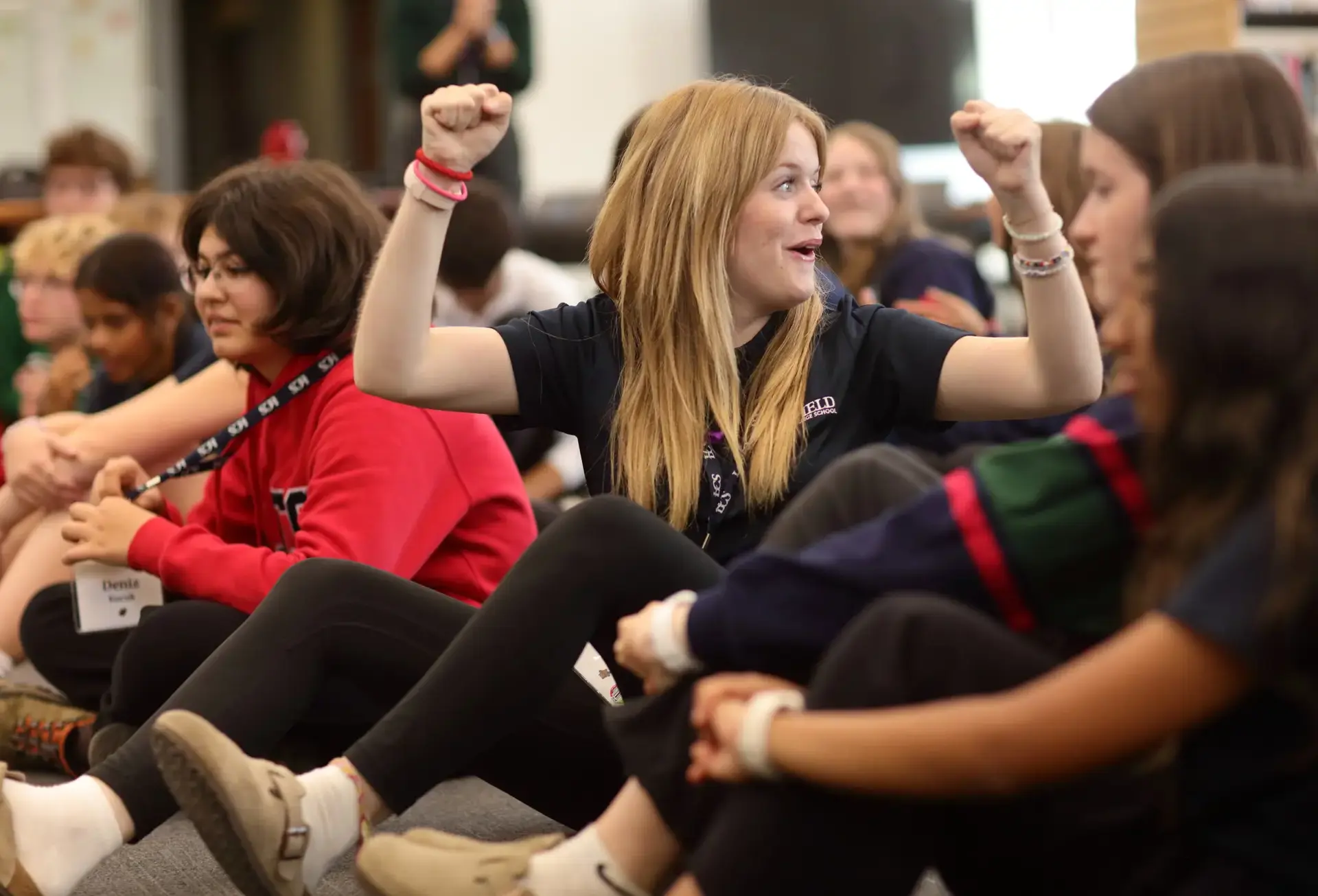Student holding up two fists in celebration