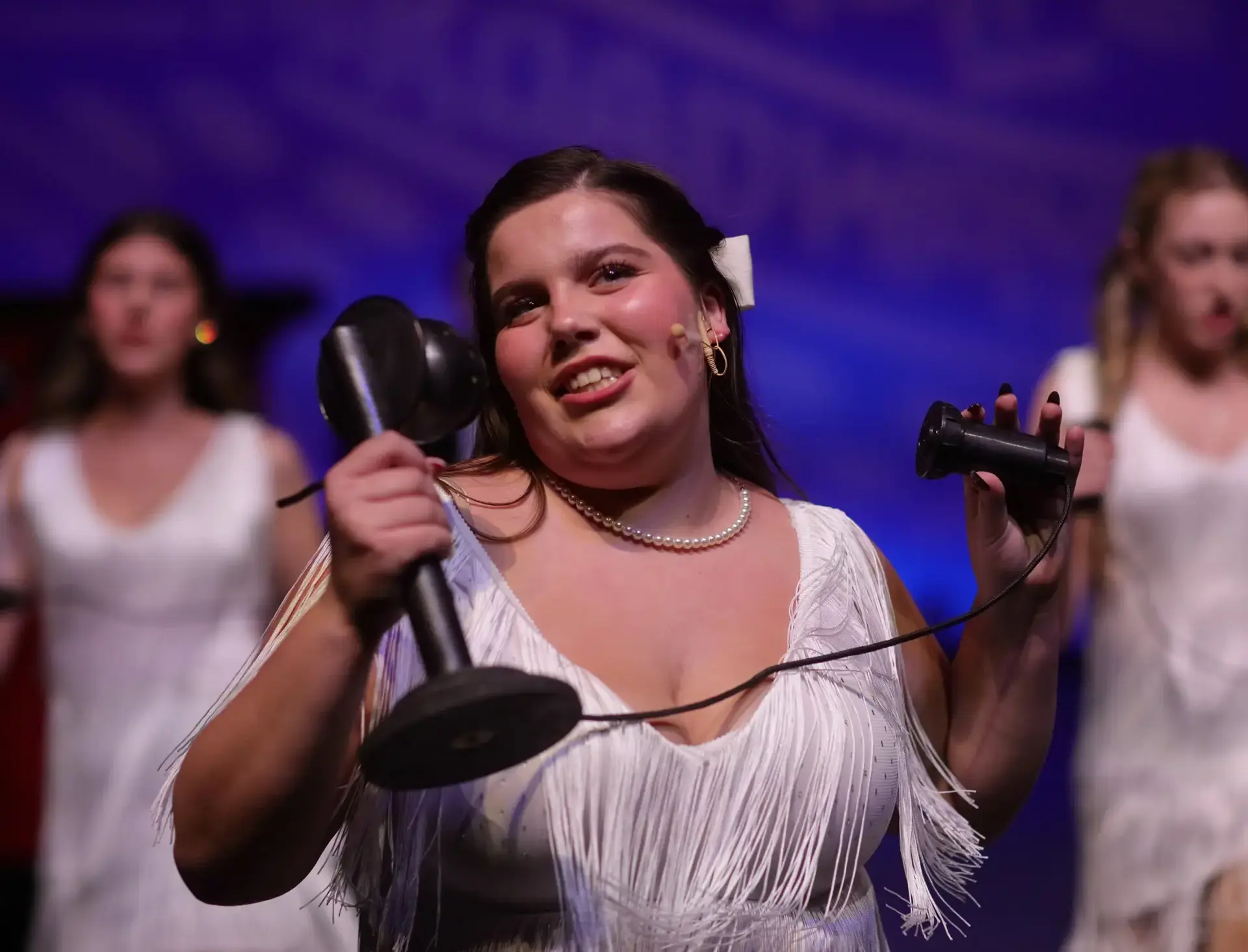 Student singing onstage