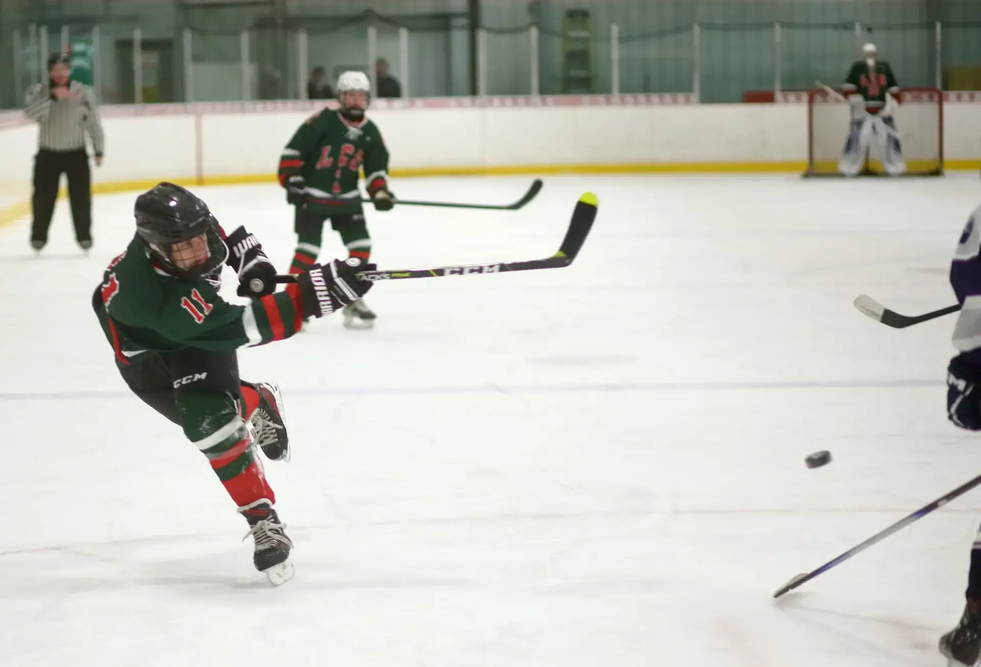 Students playing ice hockey