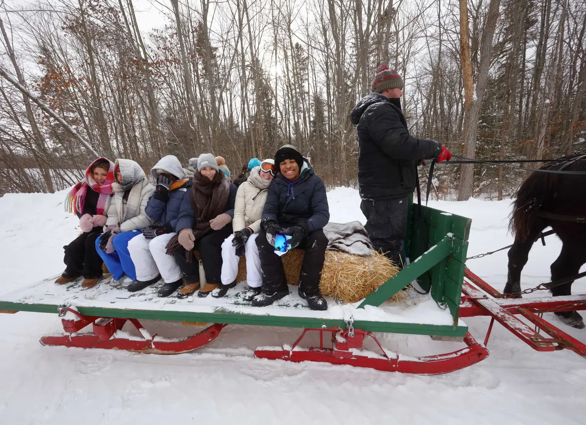 Students being pulled on sleigh