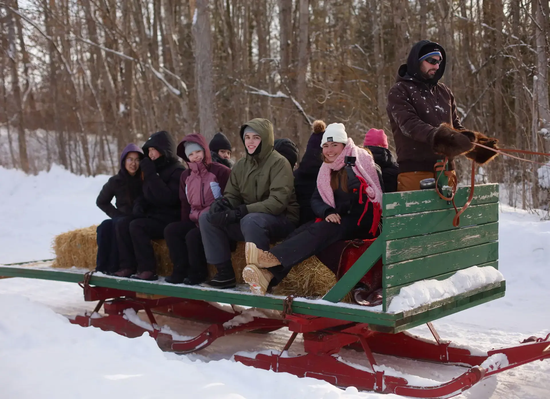 Students being pulled on sleigh