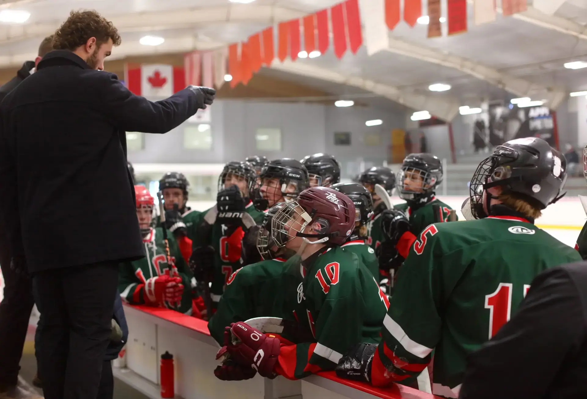 Coach giving instruction to ice hockey players