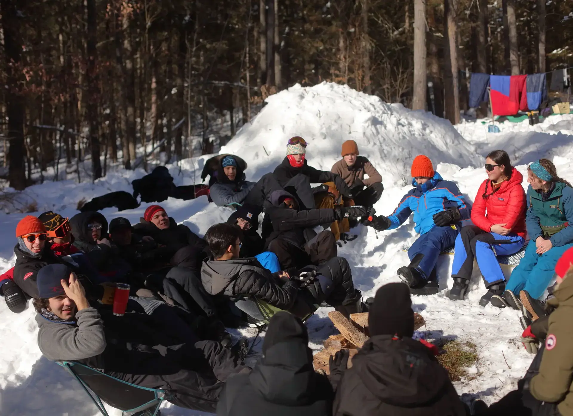 Students sitting around campfire