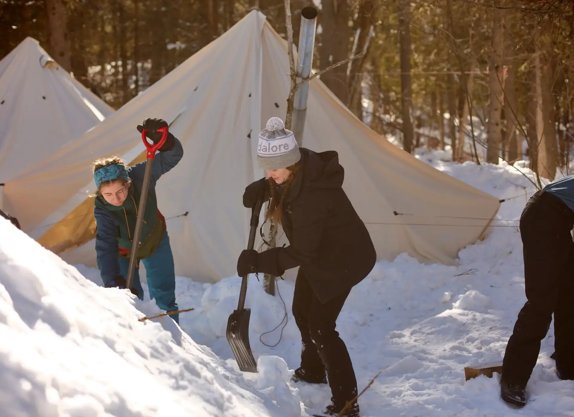 Students digging through snow
