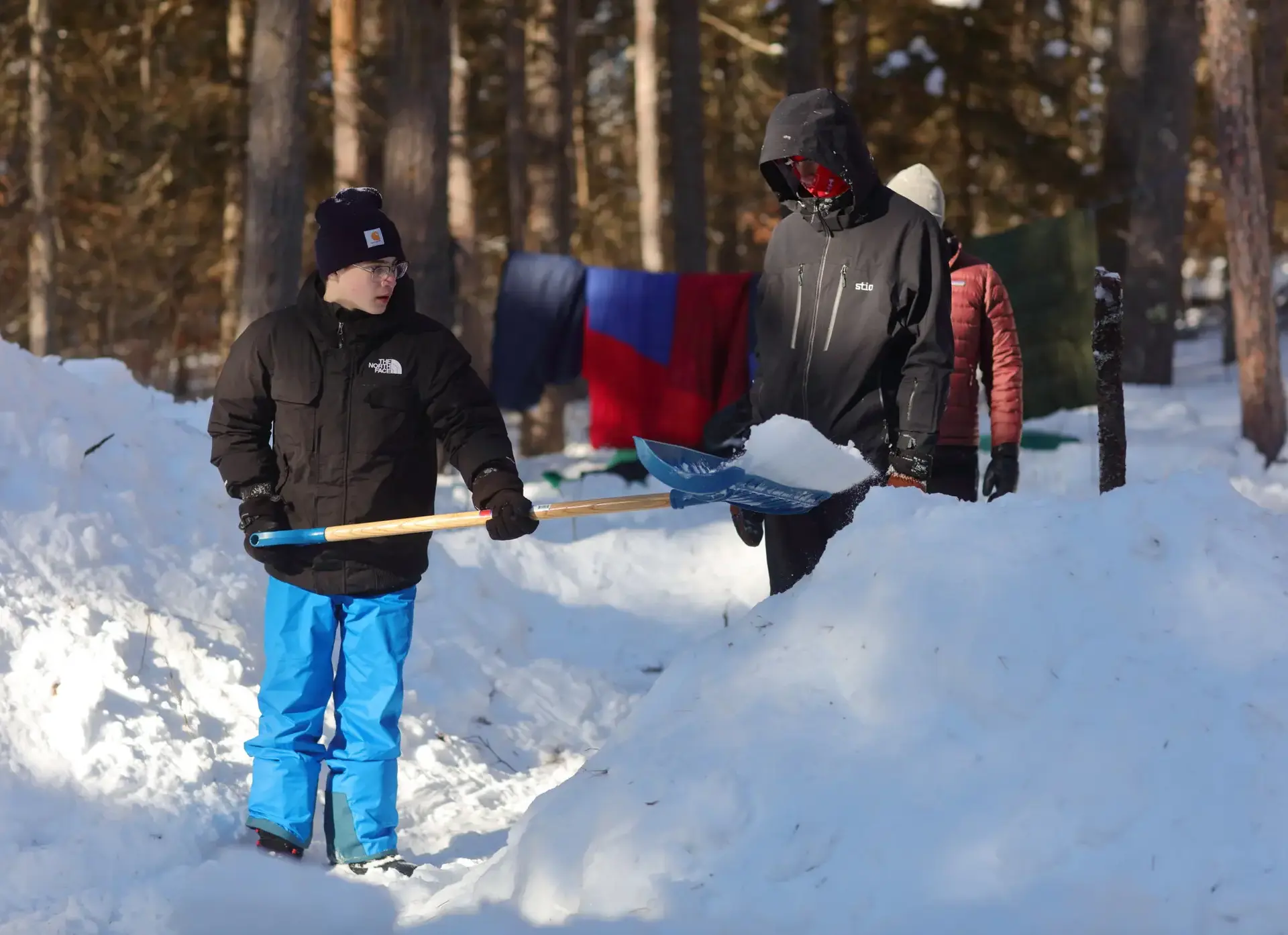 Student shovelling snow