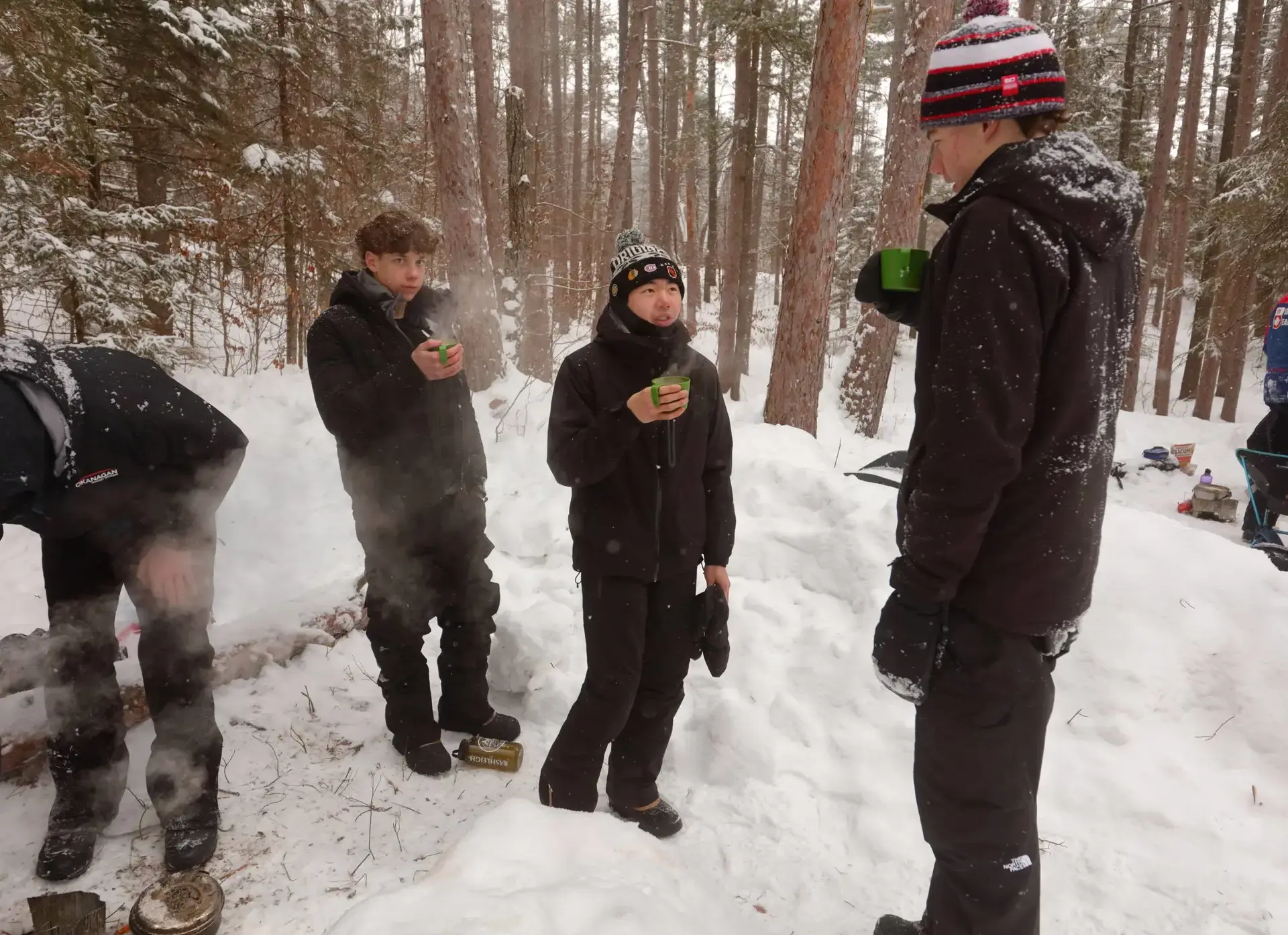 Students chatting in snowy forest