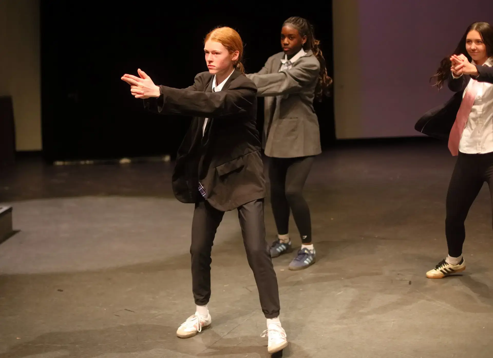 Students performing on stage