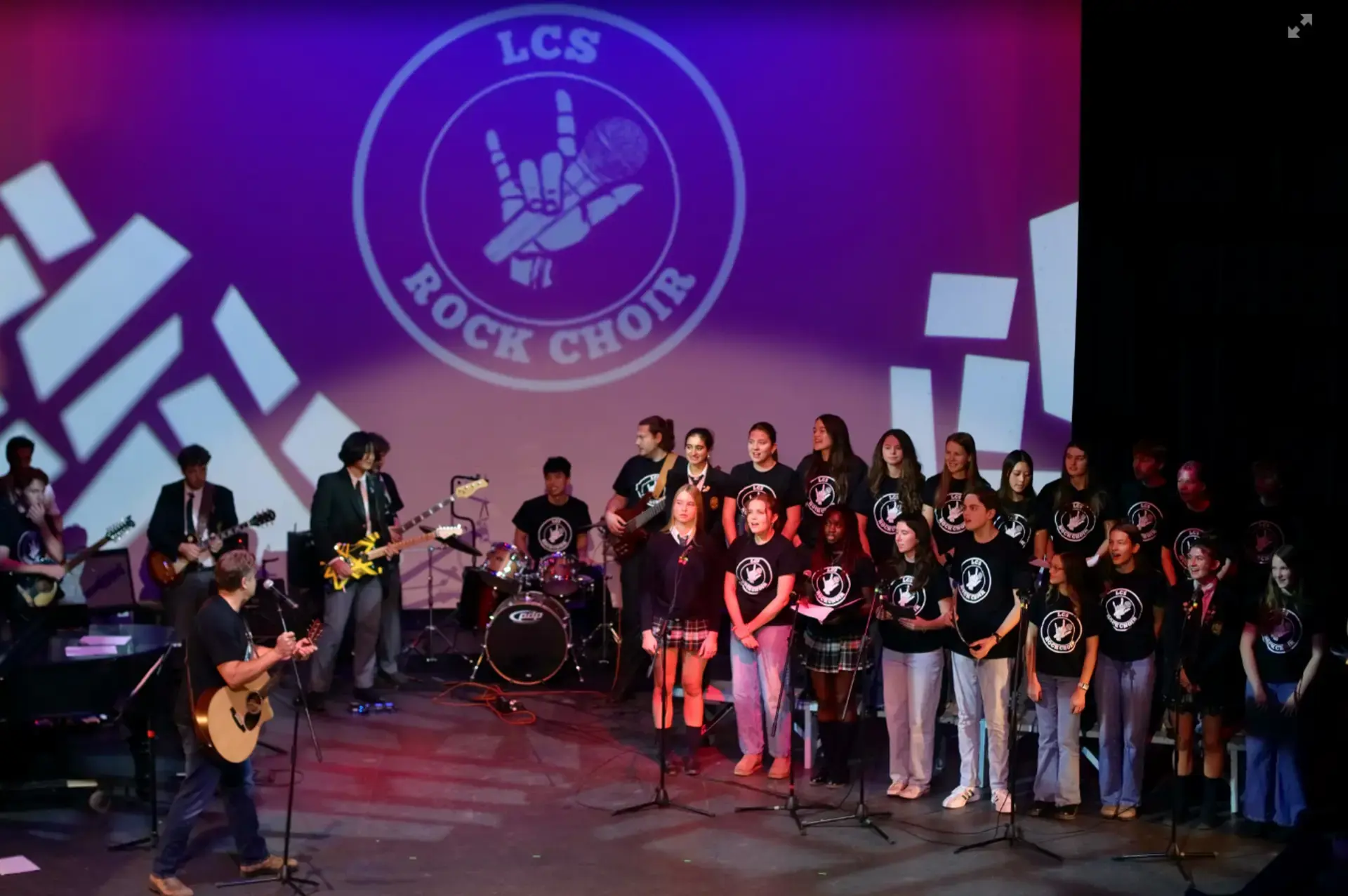 Rock Choir members performing on stage