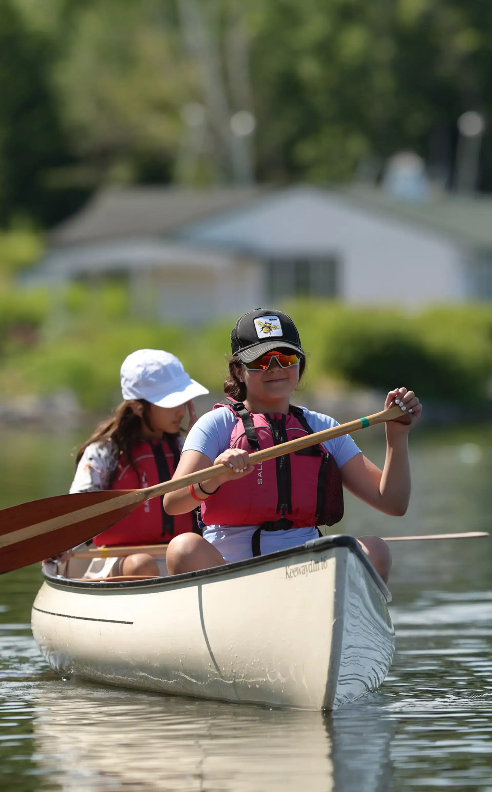 Students rowing on river