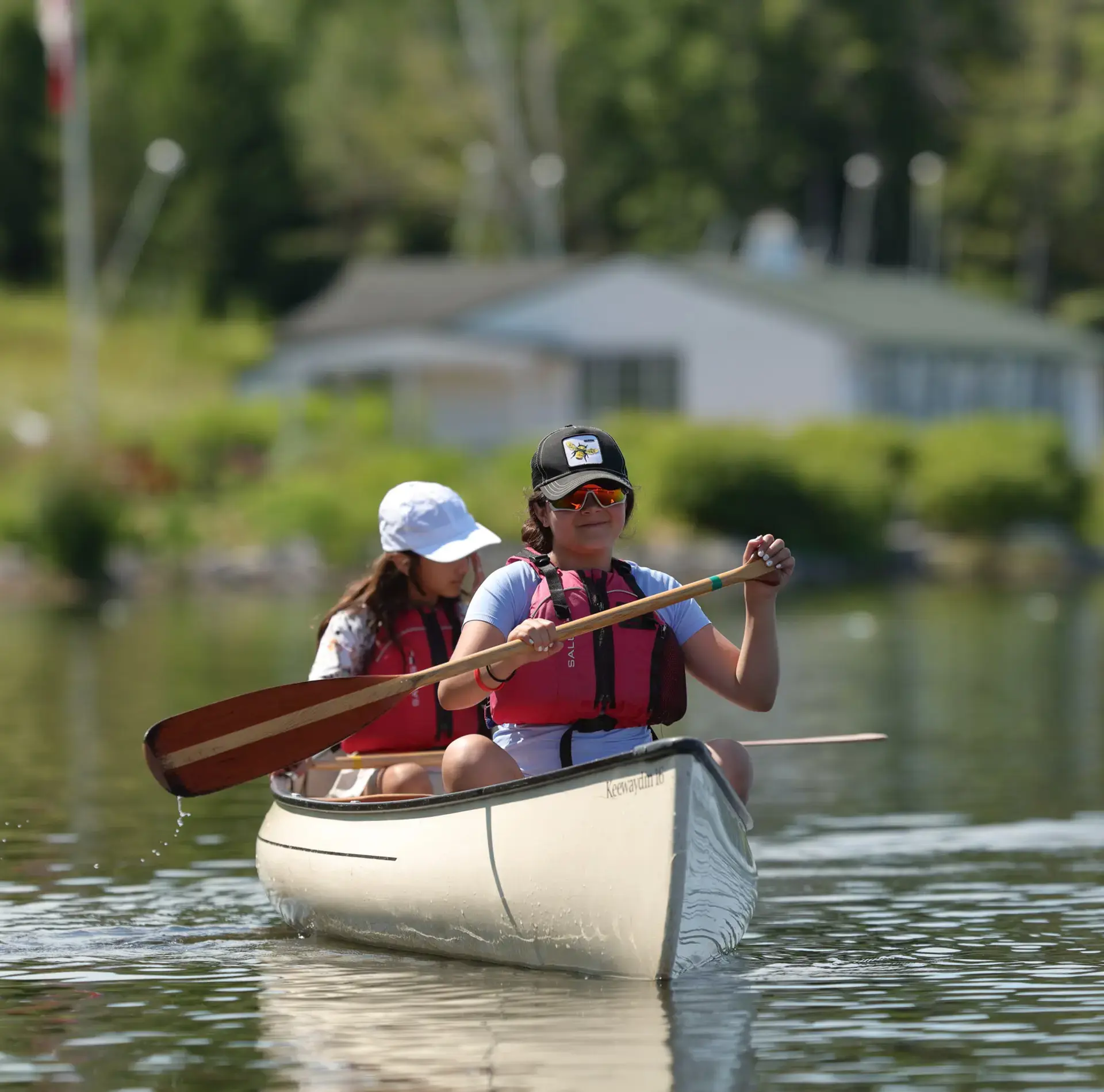 Campers canoeing on lake