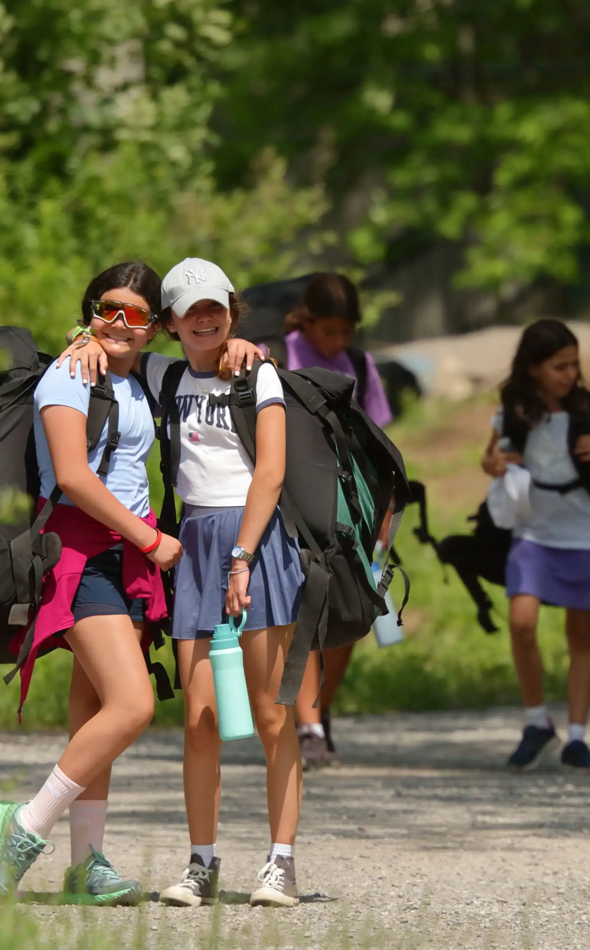 Smiling students wearing outdoor gear