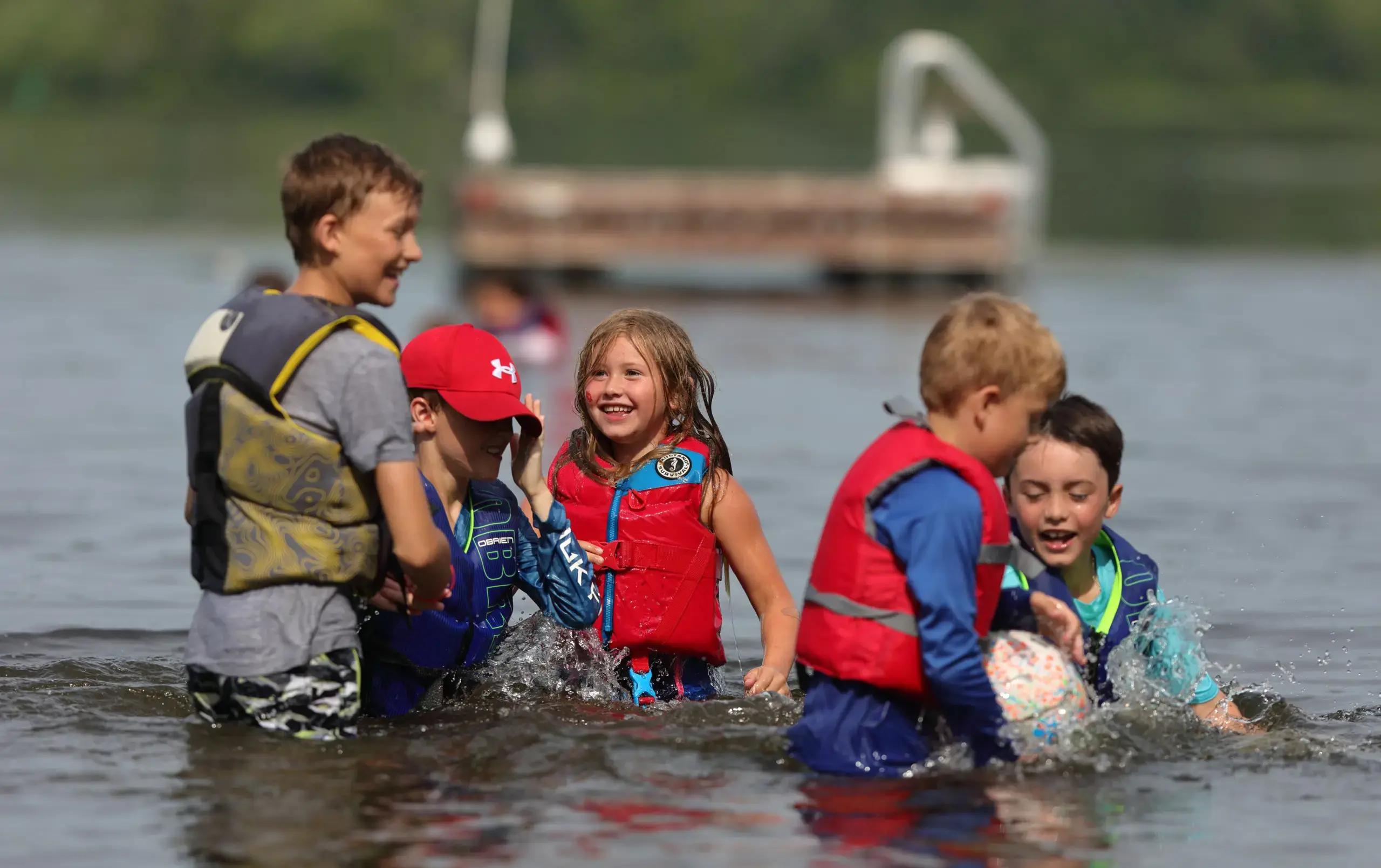 Campers swimming in lake