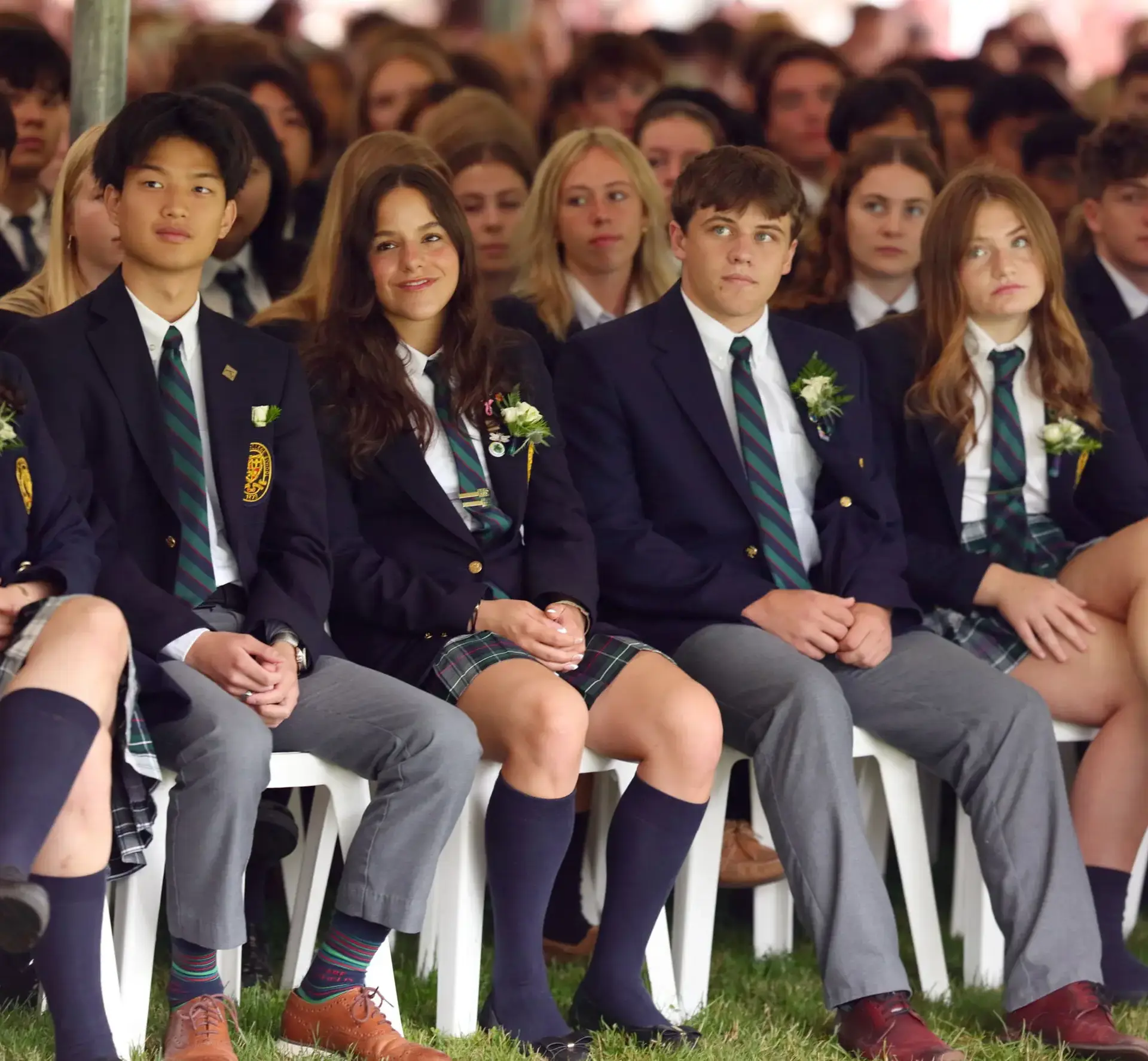 Students sitting on outdoor chairs