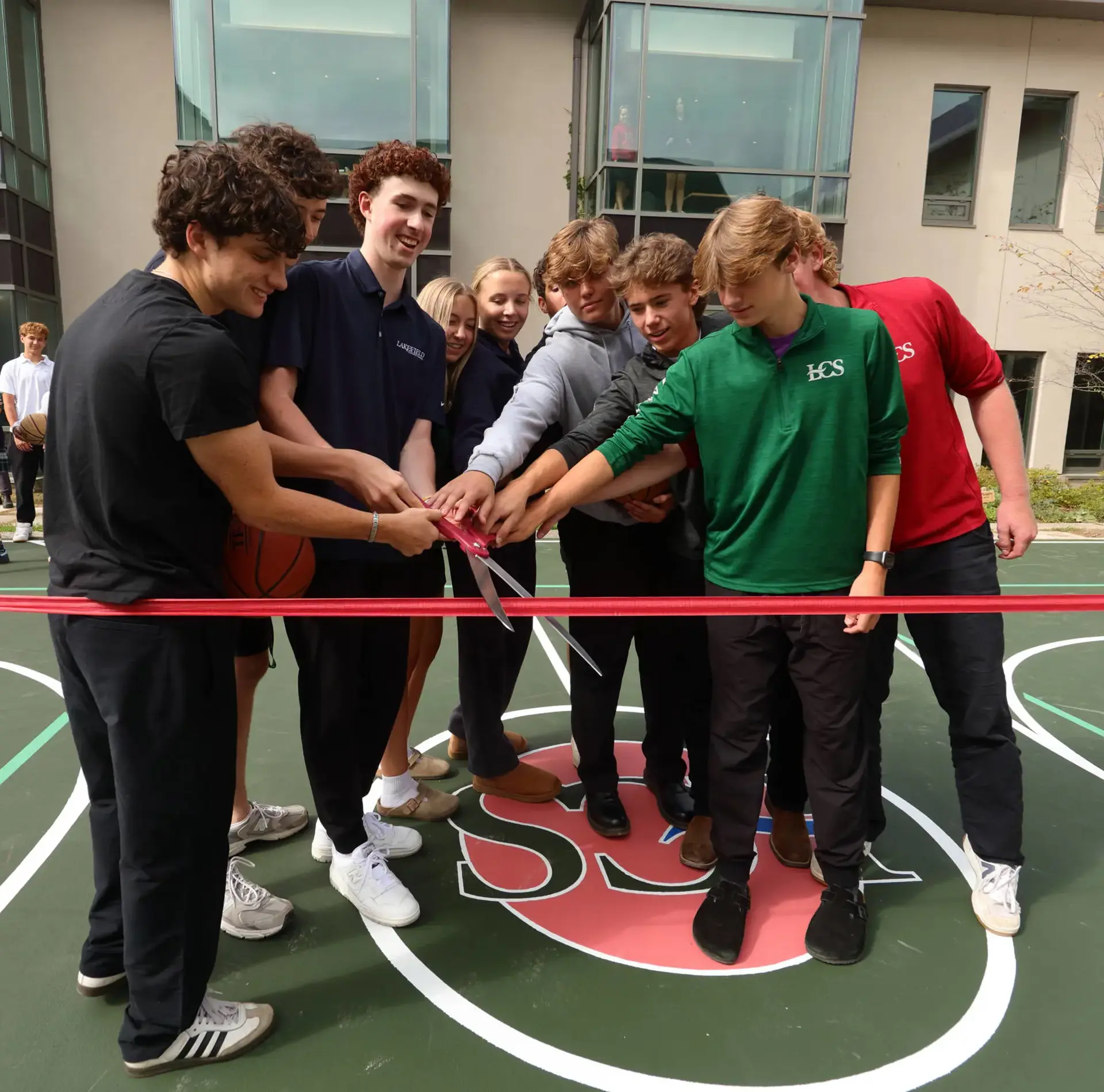 Ribbon cutting at basketball court opening