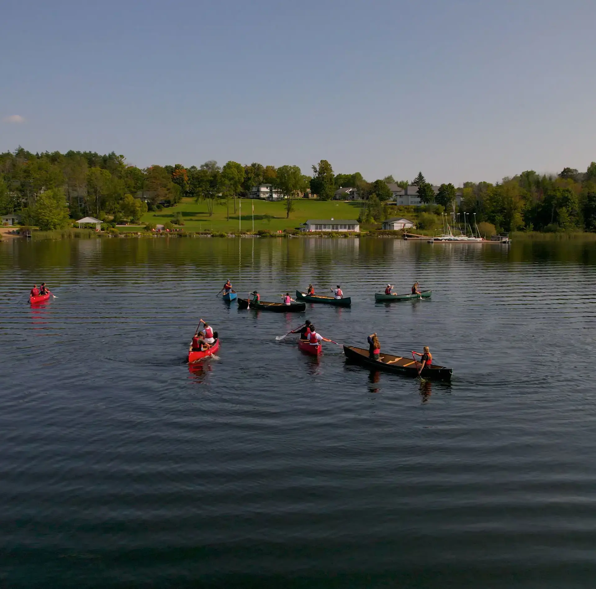 Kayaks floating on lake