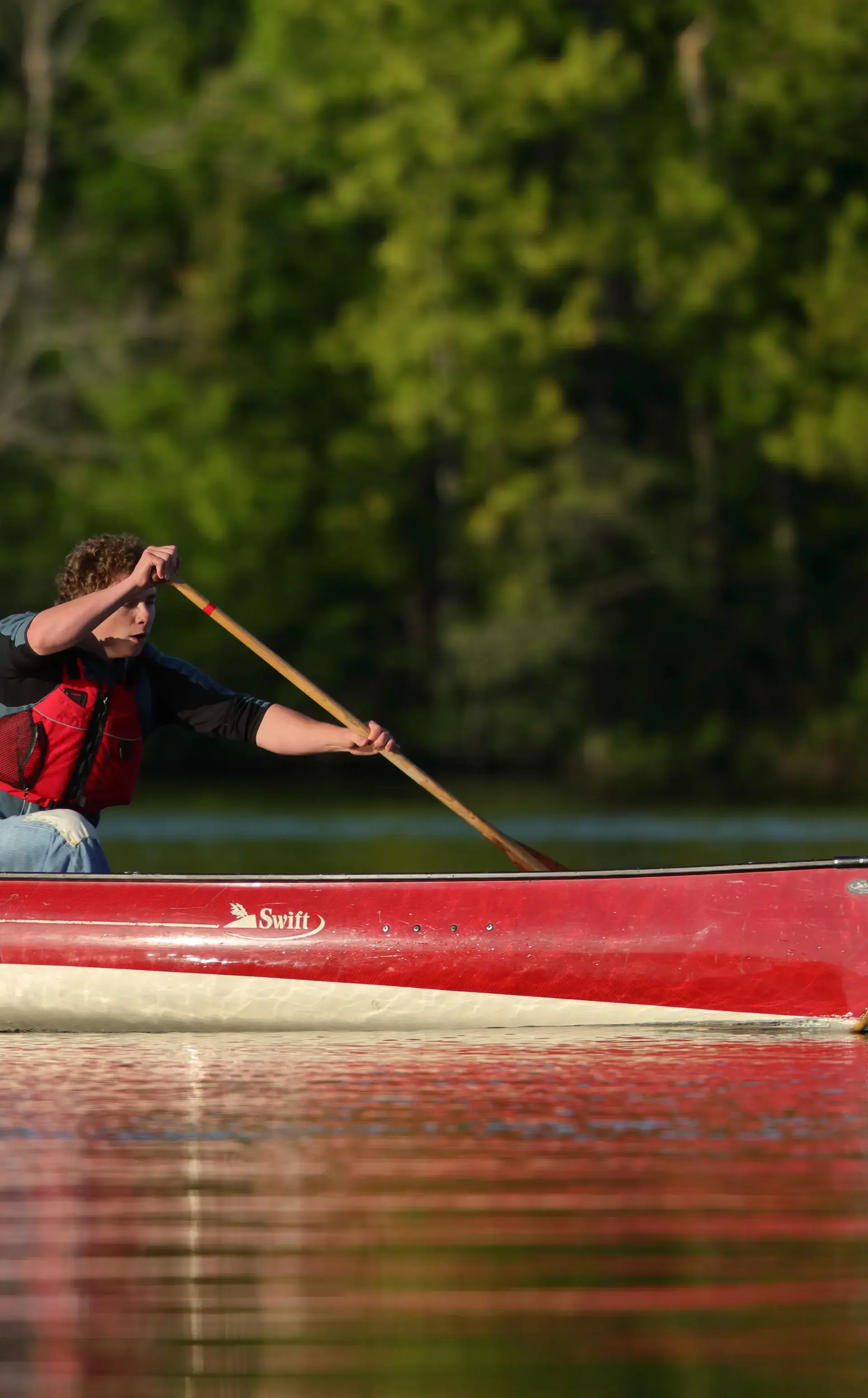 Student canoeing on the waterfront