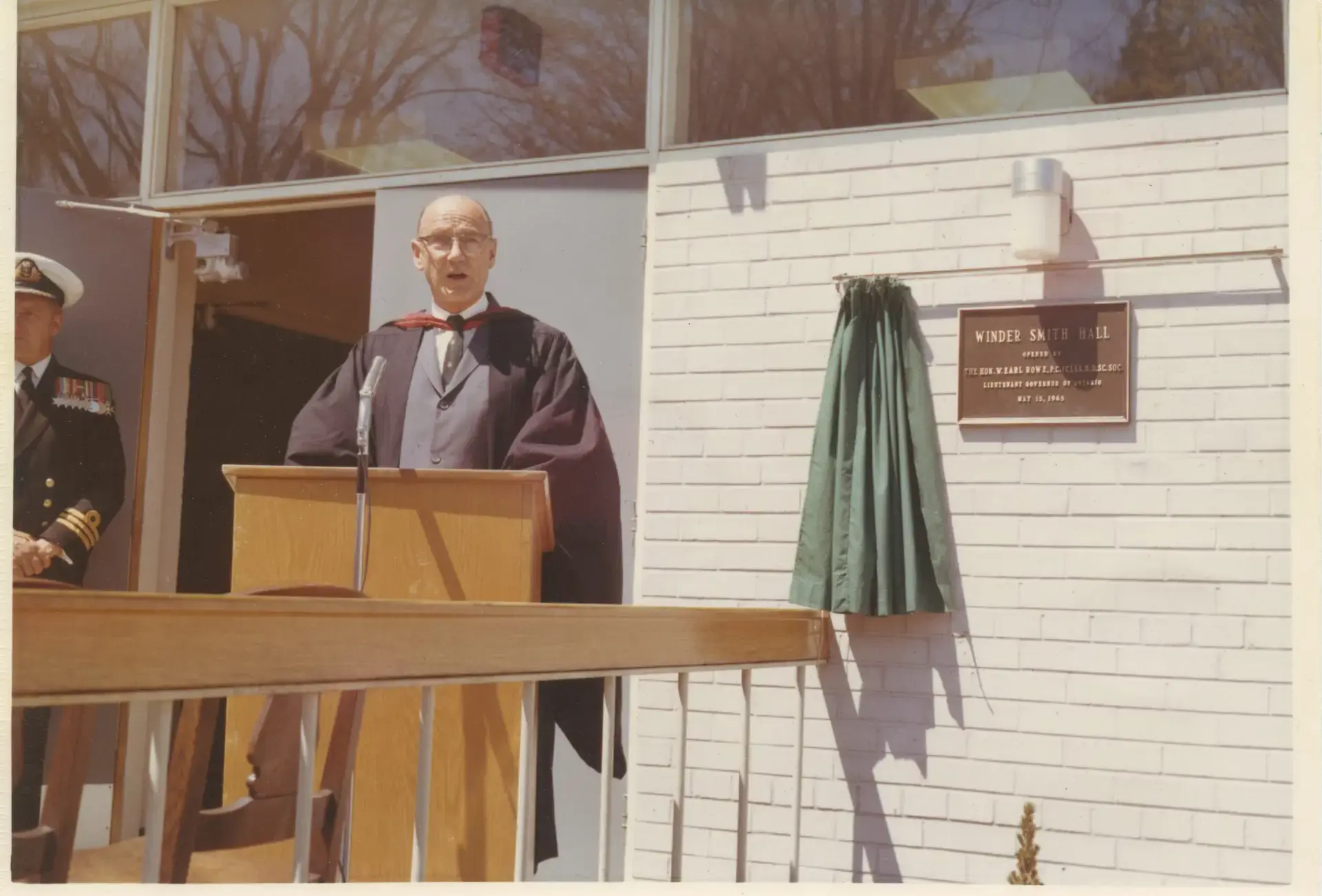 Archival photograph of Jack Matthews speaking at Winder Smith Hall opening