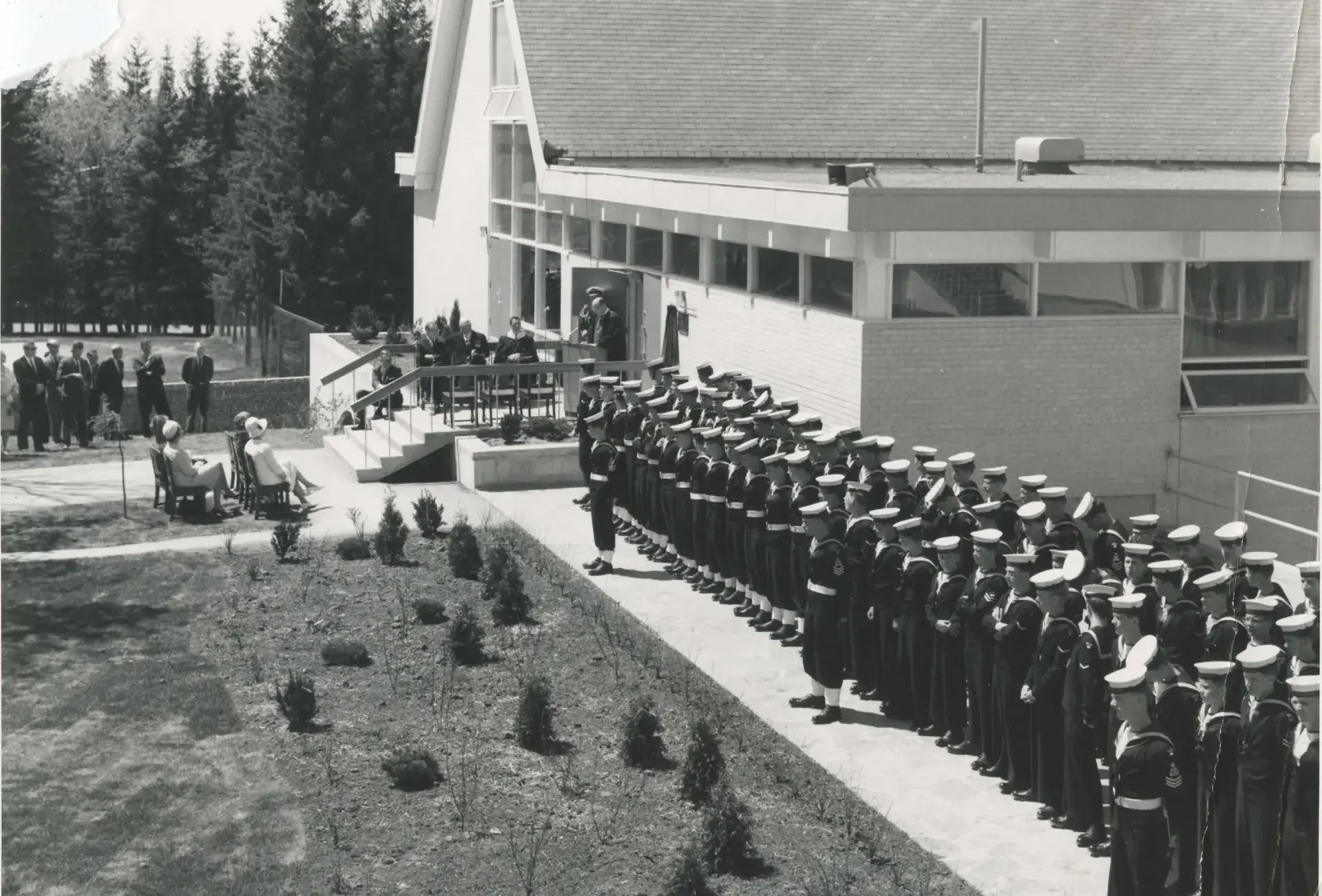 Archival photograph of students in naval uniform at opening of Winder Smith Hall