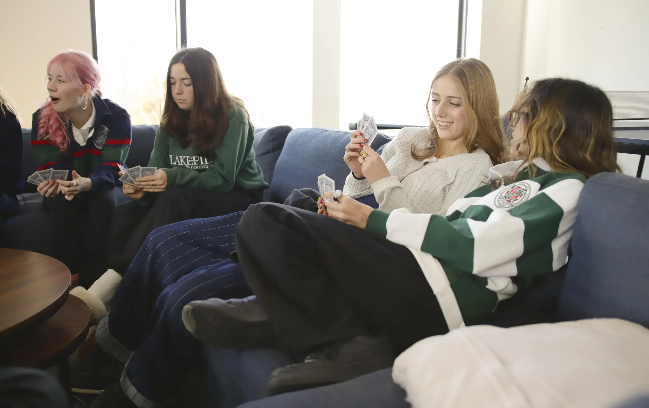 Students playing cards in common area