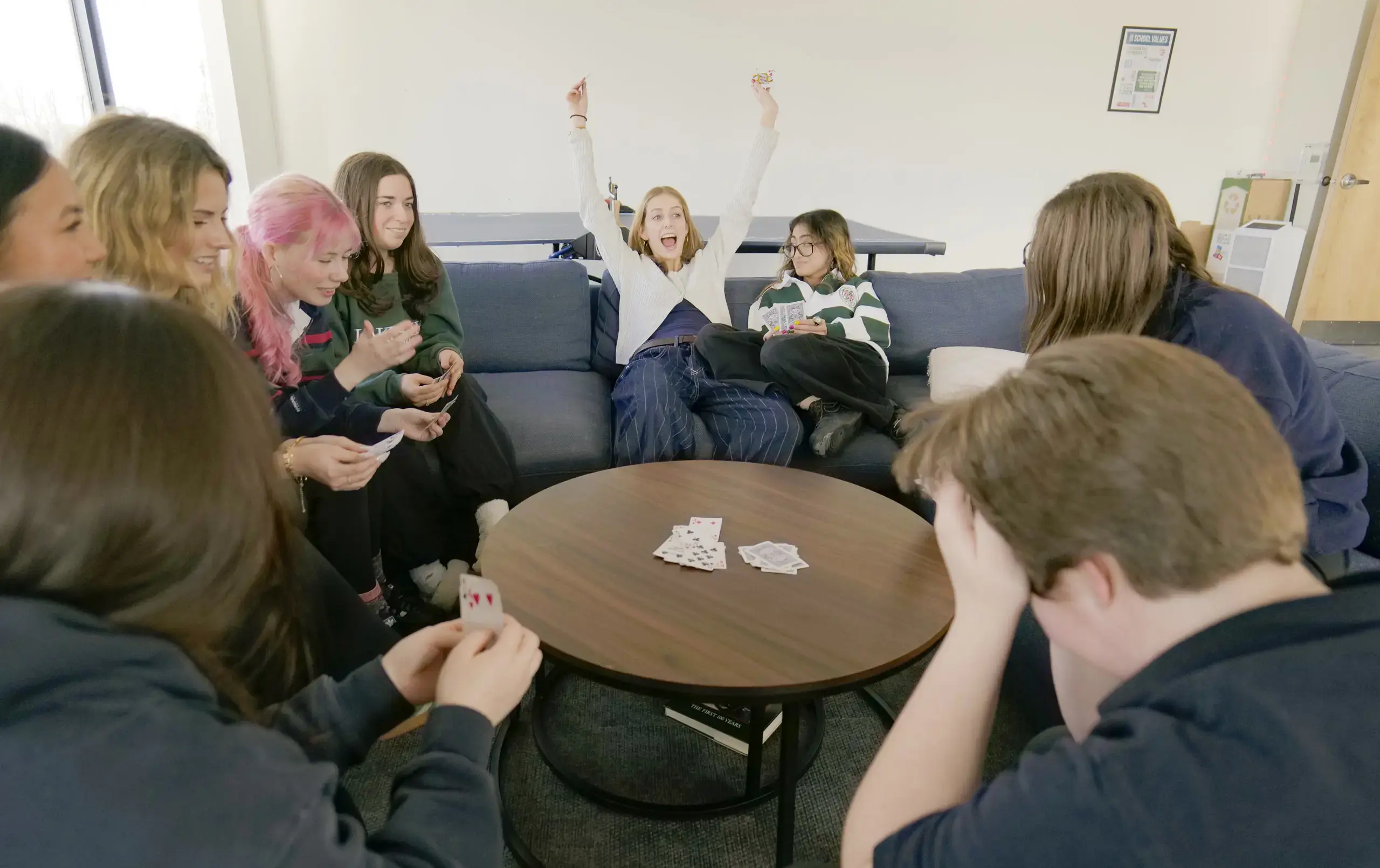 Students playing cards in common area