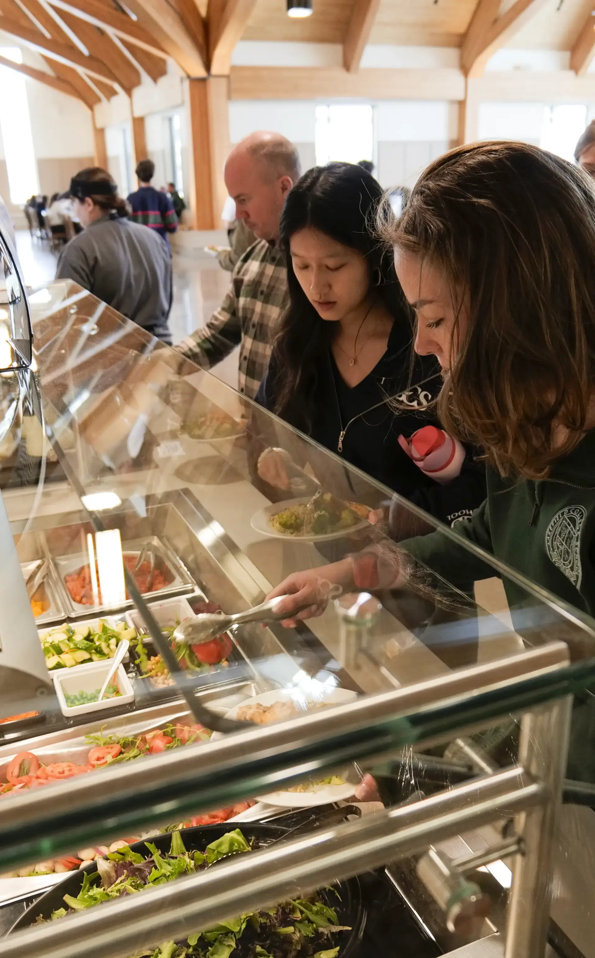 Students choosing from the Hepburn Hall salad bar