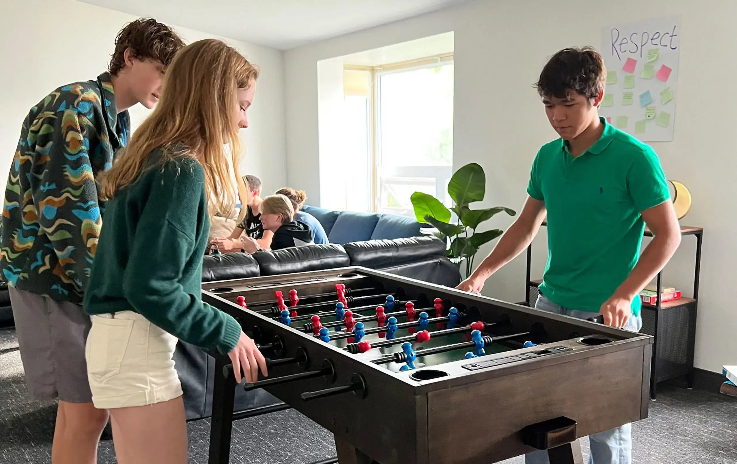 Students playing foosball